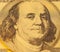 Golden Portrait of Benjamin Franklin on a one hundred dollar ban