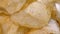Golden potato chips close up