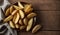 Golden Potato Wedges on Wooden Table with Cloth Backdrop, Copy Space