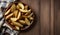 Golden Potato Wedges on Wooden Table with Cloth Backdrop, Copy Space