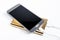 Golden powerbank with smart phone on background