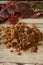 Golden raisins over wooden table with autumn grape leaves