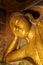 Golden reclining Buddha statue in Pho Win Taung Caves in Monywa