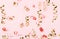 Golden and red flying confetti streamer on pink background