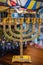 Golden religious menorah. Ancient ritual candle menorah. Hanukkah festive attribute. The Menorah is a symbol of Judaism