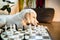 Golden retriever puppy learning to play chess. dog lies near the chessboard and watches how animal owner plays a chess