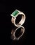 Golden ring with emerald diamond brilliant