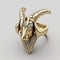 Golden ring features an intricately detailed goat head motif. AI-generated.