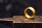 Golden ring on a goldsmith anvil in the jewelry factory, close u