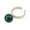 Golden ring with green malachite stone isolated on white background