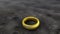 The golden ring lies on the dry gray ground. The lost ring lies on the dirty cracked ground. Generated AI.