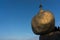 Golden rock or Kyaiktiyo pagoda with blue sky background, Myanmar