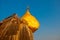 Golden rock or Kyaiktiyo pagoda with blue sky background, Myanmar
