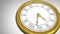 Golden roman numeral clock ticking