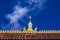 Golden roof ornament of a Buddhist temple/ monastery in Vientiane, Laos