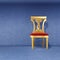 Golden royal chair against wal