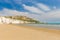 Golden sand beach of Vieste with Pizzomunno rock, Gargano peninsula, Apulia, South of Italy