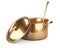 Golden saucepan, ladle and lid, top wiev.