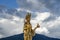 The golden sculpture of Goddess embracing the territory of Buddha Point in the mountains of Bhutan