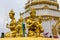 Golden sculpture man figures in fountain