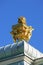 Golden sculpture on the roof  of the palace of Peter the great in Saint Petersburg