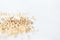 Golden seed beads scattered on textile background