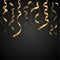 Golden serpentine on a black background. Winter holidays background with confetti for holiday greeting card.