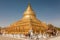 Golden Shwesandaw stupa under a blue sky