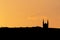 Golden Silhouette of a Church Spire at Sunset