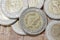 Golden and silver 1 Egyptian pound metal coins with new Suez Canal print and logo