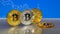 Golden and silver bitcoin on blue abstract finance background. Bitcoin cryptocurrency.