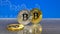 Golden and silver bitcoin on blue abstract finance background. Bitcoin cryptocurrency.