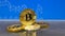 Golden and silver bitcoin on blue abstract finance background. Bitcoin cryptocurrency.