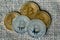 Golden and silver bitcoins on linen canvas