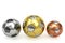 Golden, silver and bronze soccer balls on white