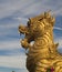 Golden singha lion statue on sky background,Thailand