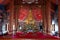 The golden sitting Buddha is main in a Church at Wat Phra That Choeng Chum Worawihan.