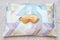 Golden sleeping eye mask on the bed, top view. Good night, flight and travel concept. Sweet dreams, siesta, insomnia, relaxation,