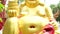 Golden smiling fat Buddha image in sitting position statue