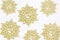 Golden snow flakes with glittering white background. Christmas t