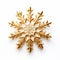 a golden snowflake laying on top of a white surface