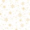 Golden snowflakes and dots on white background. Noble winter christmas seamless repeat pattern. Metallic effect. Perfect for print