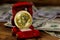 Golden souvenir coin bitcoin in car-shaped gift box for jewelry and dollars on wooden background