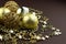 Golden sparkly Christmas balls on brown background. Magic holiday card. Christmas or New Year festive composition