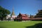 The golden spires and rooves of the historical wooden buildings within the central palace complex of the Mandalay citadel in Burma