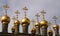 Golden Spires of the Terem Palace against a cloudy sky Moscow