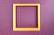Golden square frame on nacreous purple paper background