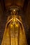 Golden standing buddha in a pagoda Bagan