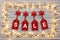 Golden star christmas lights, on a destressed wooden background, creating a border around hanging tags spelling sale