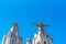 Golden Statue of Jesus Christ on the facade of the Temple of the Sacred Heart of Jesus, Barcelona, Catalonia, Spain